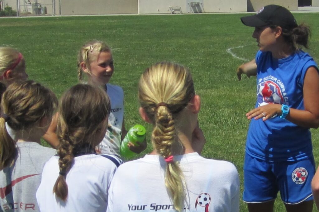 Coach Teaching Kids at World Cup Soccer Camps